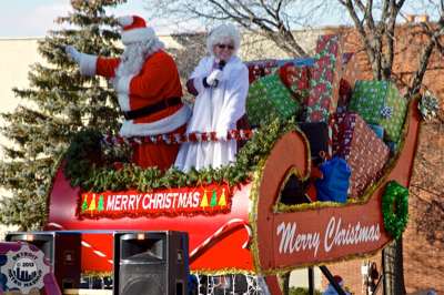 Santa and Mrs. Claus wrapping up the presents and the parade