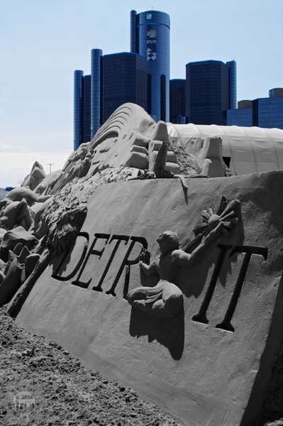 Spirit of Detroit sand sculpture with GM renaissance center in background