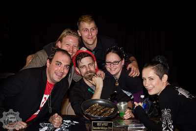 Matt Peach posing with Stone Clover band and the Best of Baconfest Trophy