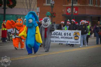 Dori, Nemo, and Bruce the Shark followed by Teamsters Local 614